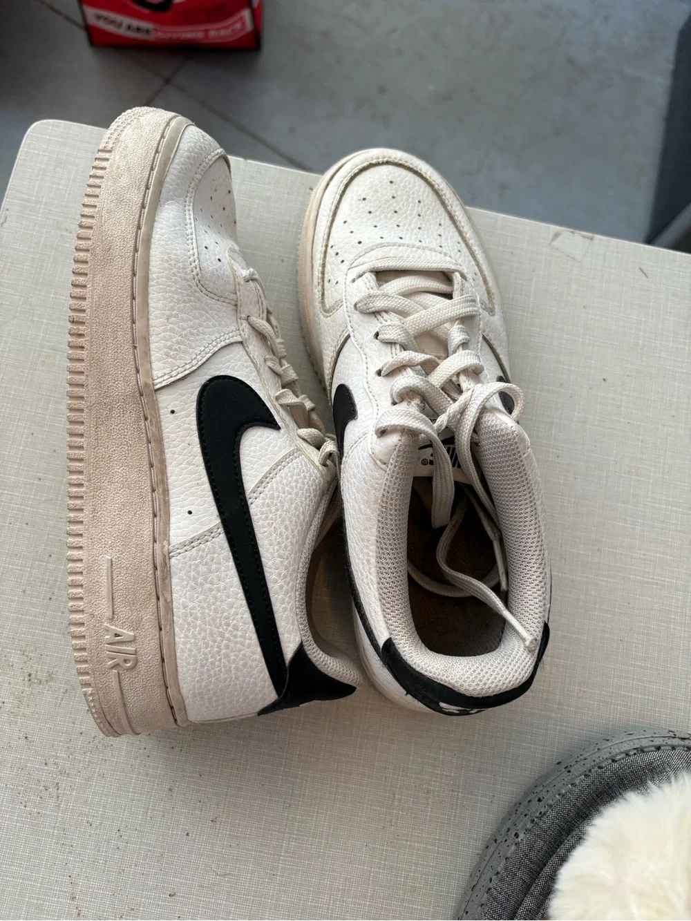 Nike White Leather Sneakers with Black Swoosh
